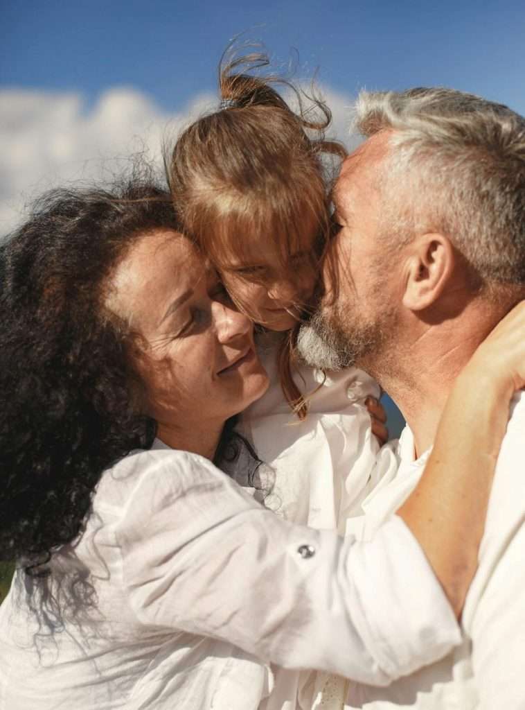 Grandparents holding child